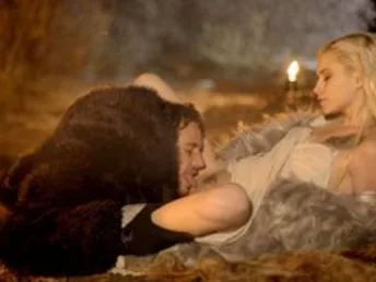 Jon Snow stands by the fire contemplating his next stir for conquest when he is approached by Khalisse. A light grope from Khalisse is all it takes for John to surrender. Arching in, he seizes her lips before guiding her to the ground by the fire so he ca