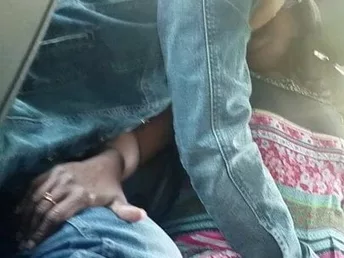 Ultra-Kinky indian cougar makes out in truck backseat with young paramour. With lips locked, paramour slips his hand down her ebony g-string and thumbs her labia. cougar's boobies pop out and she screams. recorded by frien
